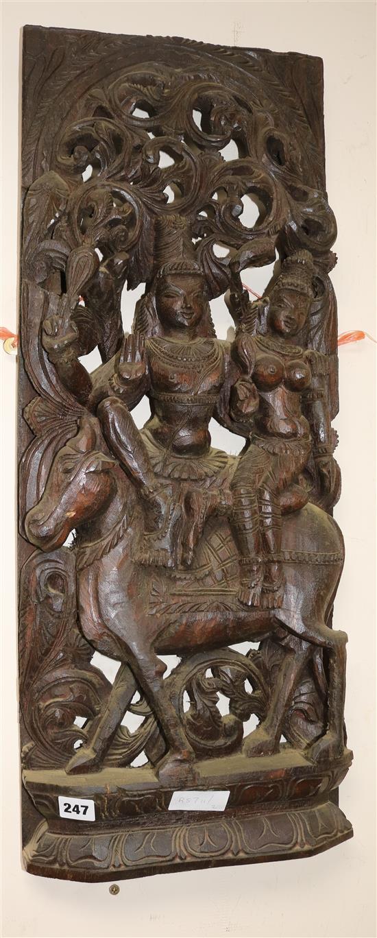 A wooden carved panel of a god and goddess width 31cm height 77cm